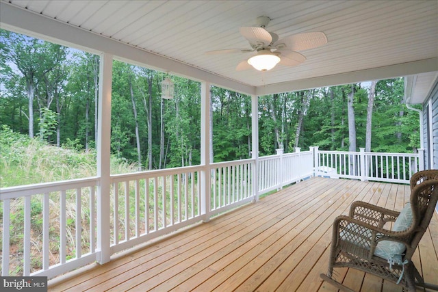wooden deck with ceiling fan