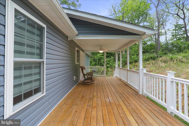 wooden deck featuring ceiling fan and a porch