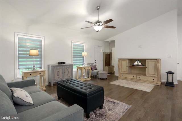 living room with a ceiling fan, dark wood-style flooring, lofted ceiling, and baseboards