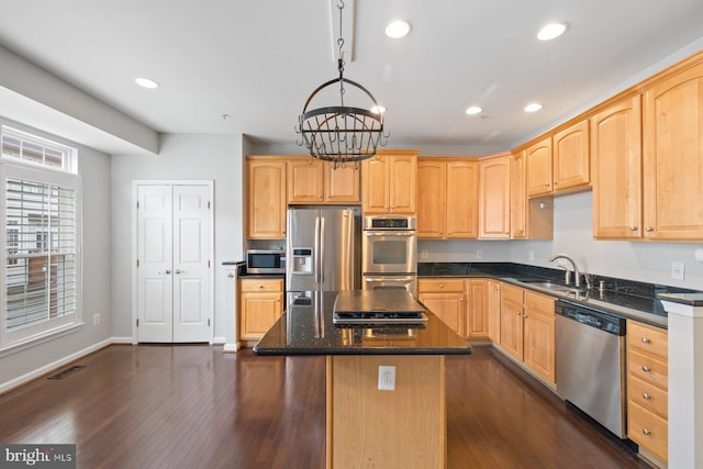 713 Norfolk Ln, Alexandria, VA 22314 - kitchen featuring stainless steel appliances, light brown cabinets, a chandelier, recessed lighting, and a center island