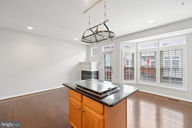 713 Norfolk Ln, Alexandria, VA 22314 - kitchen with baseboards, dark wood-style flooring, recessed lighting, and plenty of natural light