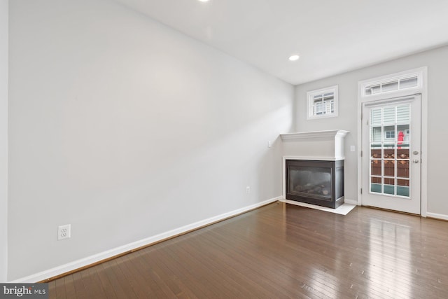 713 Norfolk Ln, Alexandria, VA 22314 - unfurnished living room featuring a fireplace with flush hearth, wood-type flooring, baseboards, and recessed lighting