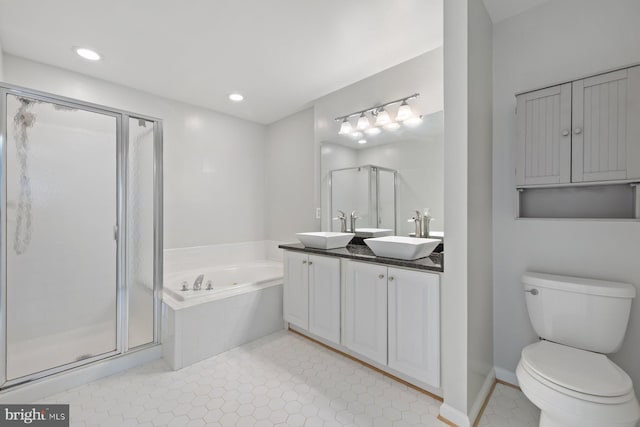 713 Norfolk Ln, Alexandria, VA 22314 - full bath featuring a shower stall, a bath, double vanity, toilet, and recessed lighting