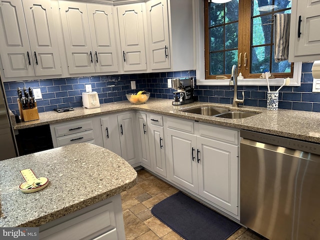 414 Elberta Ave, Salisbury, MD 21801 - kitchen featuring dishwasher, a sink, white cabinetry, decorative backsplash, and light stone counters