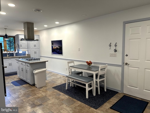 414 Elberta Ave, Salisbury, MD 21801 - kitchen with island exhaust hood, stainless steel gas cooktop, a sink, recessed lighting, and decorative backsplash