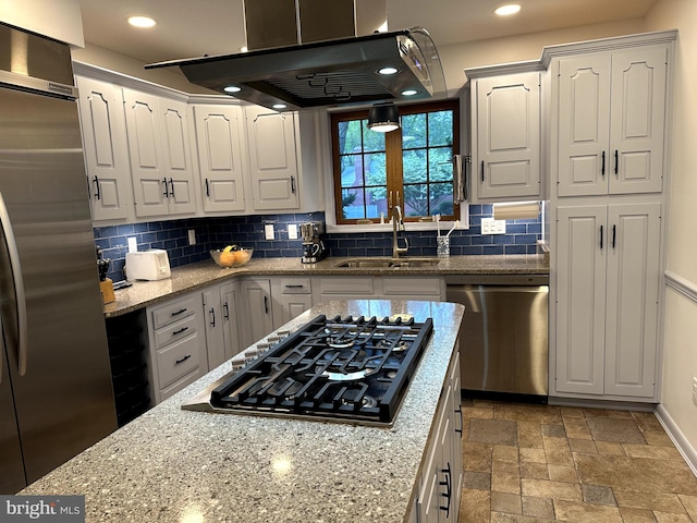 414 Elberta Ave, Salisbury, MD 21801 - kitchen featuring appliances with stainless steel finishes, a sink, island range hood, tasteful backsplash, and white cabinets
