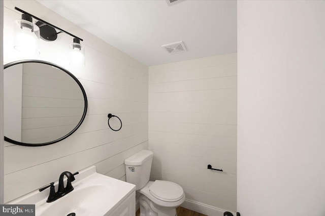 half bath featuring a sink and toilet