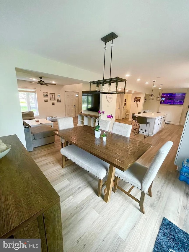 dining area with light wood finished floors, recessed lighting, and a ceiling fan