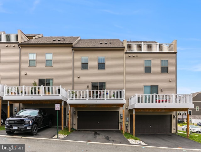 308 Bodega Ter SE, Leesburg, VA 20175 - back of property with driveway, a carport, and a garage