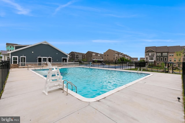 308 Bodega Ter SE, Leesburg, VA 20175 - community pool with fence, a patio area, and a residential view