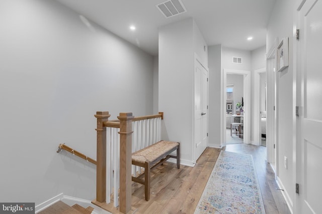 308 Bodega Ter SE, Leesburg, VA 20175 - hallway with light wood-type flooring, baseboards, recessed lighting, and an upstairs landing