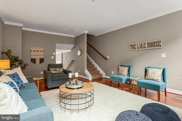 3911 Fleet St, Baltimore, MD 21224 - living room with wood finished floors, baseboards, stairs, and crown molding