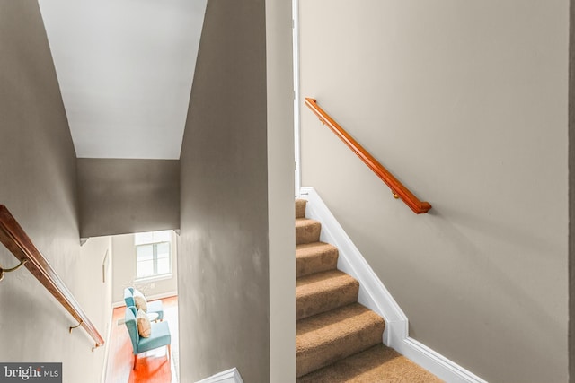 3911 Fleet St, Baltimore, MD 21224 - staircase with baseboards and carpet floors