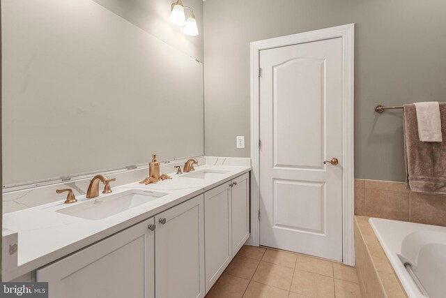 3911 Fleet St, Baltimore, MD 21224 - full bath featuring tiled bath, tile patterned floors, and double vanity