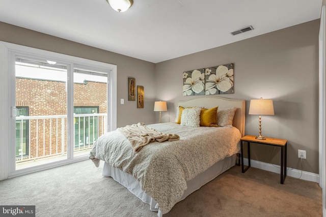3911 Fleet St, Baltimore, MD 21224 - carpeted bedroom featuring access to exterior and baseboards