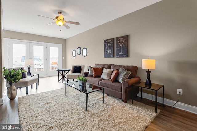 3911 Fleet St, Baltimore, MD 21224 - living room with french doors, wood finished floors, ceiling fan, and baseboards