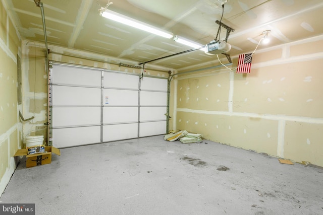 3911 Fleet St, Baltimore, MD 21224 - garage featuring a garage door opener