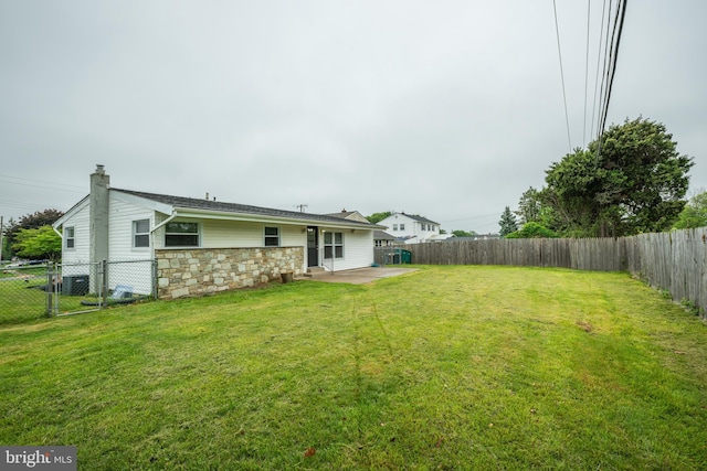 view of yard featuring a patio area and central AC unit