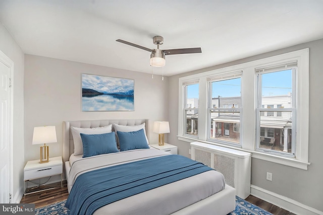 128 Linton St, Philadelphia, PA 19120 - bedroom with wood finished floors, radiator, baseboards, and a ceiling fan