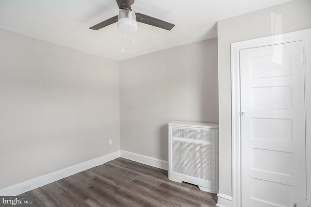 128 Linton St, Philadelphia, PA 19120 - unfurnished room with dark wood-style flooring, a ceiling fan, and baseboards