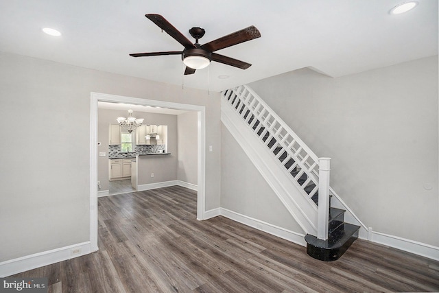 128 Linton St, Philadelphia, PA 19120 - stairway with ceiling fan, wood finished floors, baseboards, recessed lighting, and a chandelier