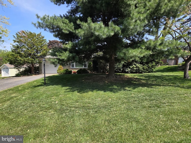 123 Westbrook Dr, Lancaster, PA 17603 - view of front facade with a front lawn, asphalt driveway, and an attached garage