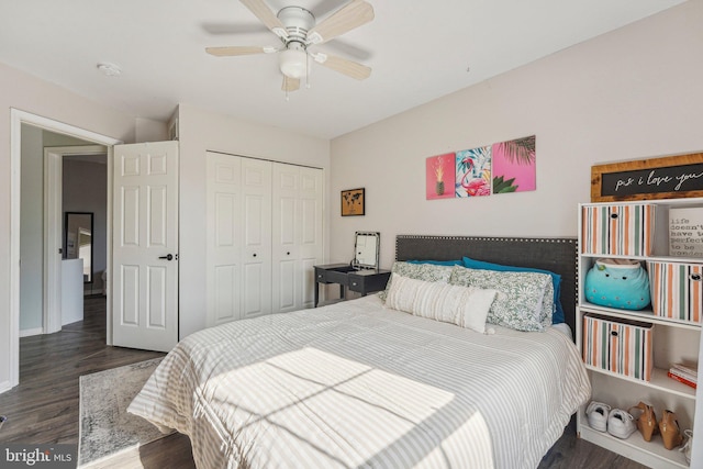 bedroom with wood finished floors, a closet, and ceiling fan