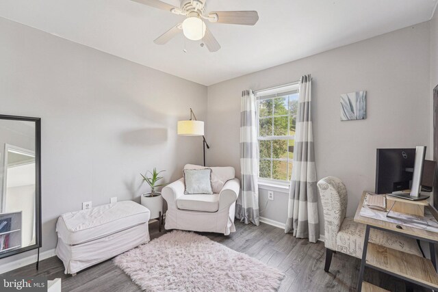 office featuring baseboards, wood finished floors, and a ceiling fan