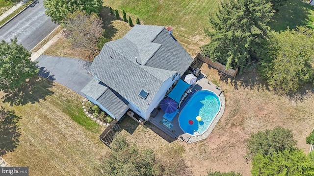 view of subject property featuring a pool