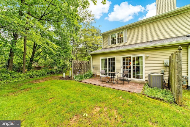 11 Oleander Ct, Lawrenceville, NJ 08648 - rear view of house with cooling unit, a patio, and a chimney