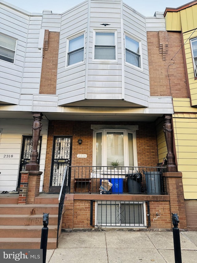 multi unit property featuring brick siding