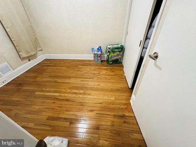 detailed view of wood finished floors and baseboards