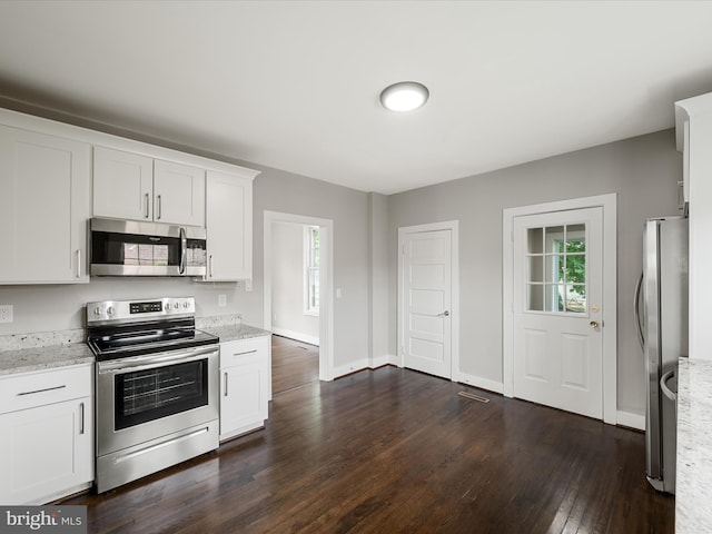 19 W Jackson St, Front Royal, VA 22630 - kitchen with appliances with stainless steel finishes, dark wood-style floors, white cabinetry, light stone counters, and baseboards