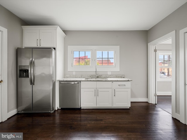 19 W Jackson St, Front Royal, VA 22630 - kitchen featuring appliances with stainless steel finishes, a sink, light stone countertops, and healthy amount of natural light