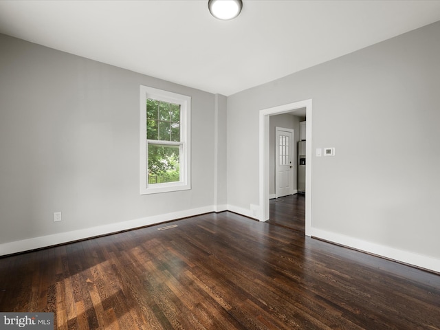 19 W Jackson St, Front Royal, VA 22630 - empty room featuring dark wood-style floors and baseboards