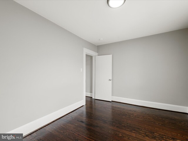 19 W Jackson St, Front Royal, VA 22630 - empty room with baseboards and dark wood-style flooring