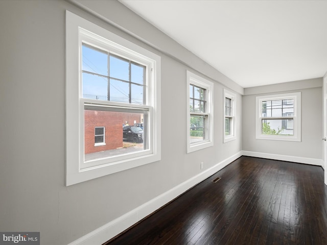 19 W Jackson St, Front Royal, VA 22630 - spare room featuring baseboards and dark wood-style floors