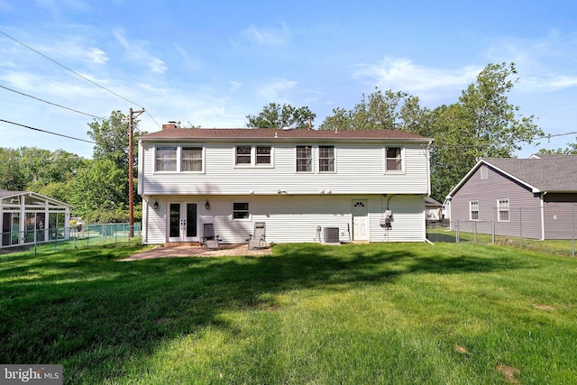5 Neptune Ln, Willingboro, NJ 08046 - rear view of house with french doors, a chimney, and central air condition unit