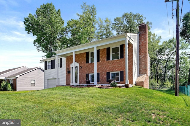 5 Neptune Ln, Willingboro, NJ 08046 - bi-level home featuring a chimney, an attached garage, and brick siding