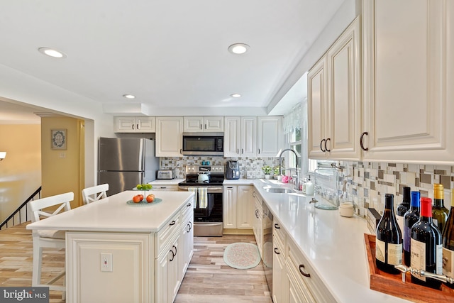 5 Neptune Ln, Willingboro, NJ 08046 - kitchen featuring appliances with stainless steel finishes, a sink, recessed lighting, light countertops, and backsplash