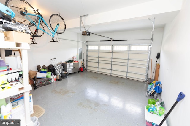 41259 Gloucester Dr, Rehoboth Beach, DE 19971 - garage featuring a garage door opener and electric panel