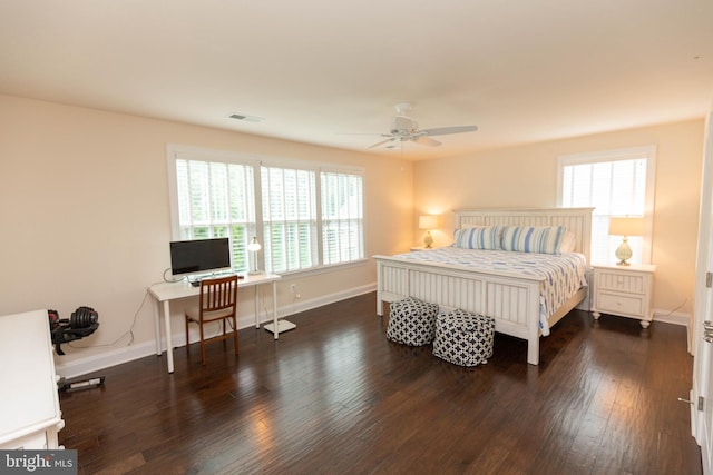 41259 Gloucester Dr, Rehoboth Beach, DE 19971 - bedroom with multiple windows, a desk, wood finished floors, and baseboards