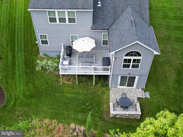 41259 Gloucester Dr, Rehoboth Beach, DE 19971 - back of house with roof with shingles, a deck, a yard, a patio, and outdoor dining space