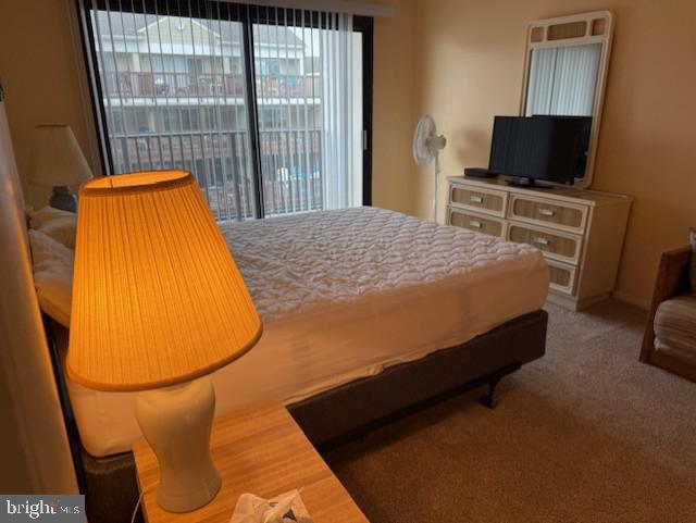 72nd St Unit 35, Ocean City, MD 21842 - bedroom with multiple windows, access to exterior, and carpet floors