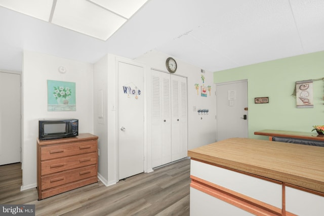 72nd St Unit 35, Ocean City, MD 21842 - kitchen with black microwave and light wood-style floors