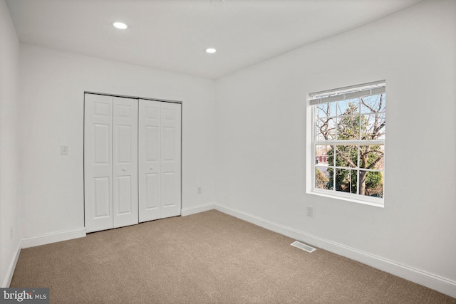2305 James St, Baltimore, MD 21230 - unfurnished bedroom featuring carpet, baseboards, recessed lighting, and a closet