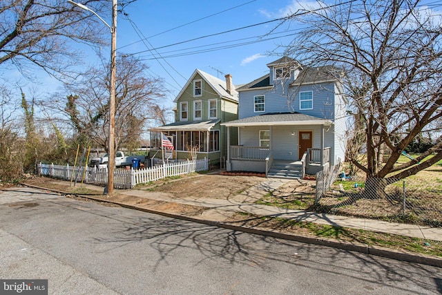 2305 James St, Baltimore, MD 21230 - american foursquare style home with a porch and a shingled roof