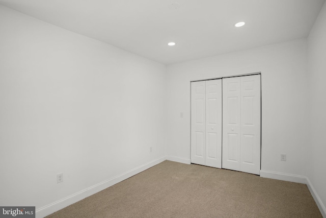 2305 James St, Baltimore, MD 21230 - unfurnished bedroom featuring carpet flooring, recessed lighting, baseboards, and a closet