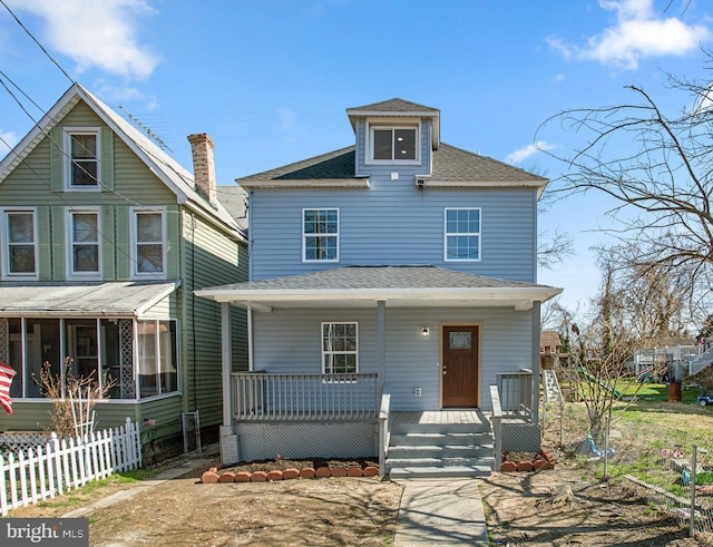 2305 James St, Baltimore, MD 21230 - traditional style home featuring covered porch, roof with shingles, and fence