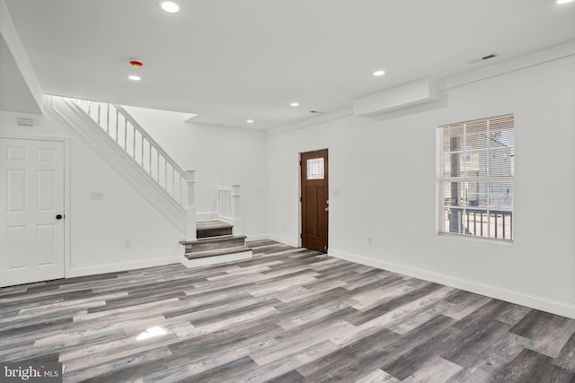 2305 James St, Baltimore, MD 21230 - unfurnished living room featuring wood finished floors, stairs, recessed lighting, and baseboards